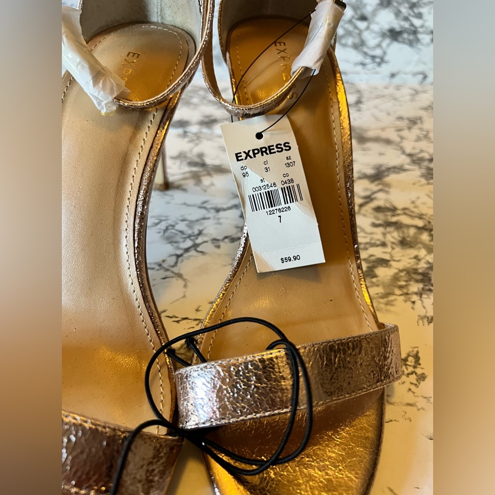 Express high heels, rose gold color size 7 brand new. Never used.